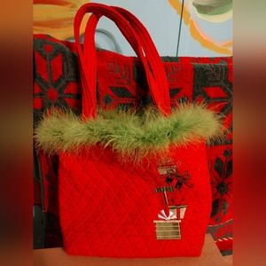 Red Christmas quilted purse with a green boa around the top
